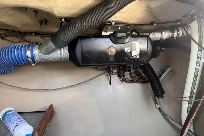 Slide: The Image of 1989 C&C 30 MKII boat interior showing ventilation system and wiring. - 82