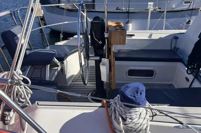 Slide: The Image of Cockpit of a 1989 C&C 30 MKII sailboat with steering wheel and seating. - 29