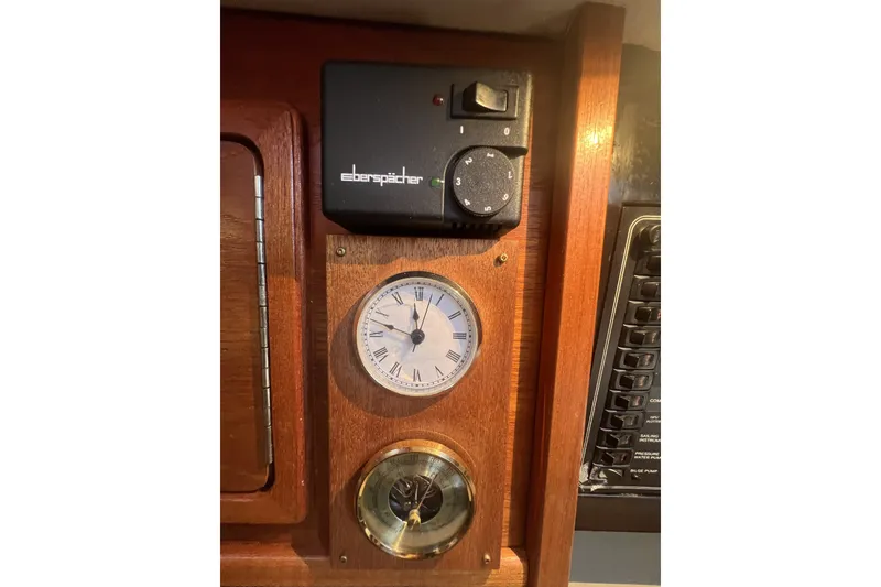 Slide: The Image of Control panel with clock and barometer on a 1989 C&C 30 MKII sailboat. - 58