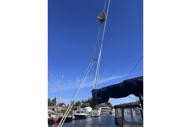 Slide: The Image of Sailboat mast of 1989 C&C 30 MKII against clear blue sky in marina. - 87