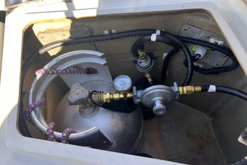 Slide: The Image of Propane tank setup in a 1989 C&C 30 MKII sailboat compartment. - 40