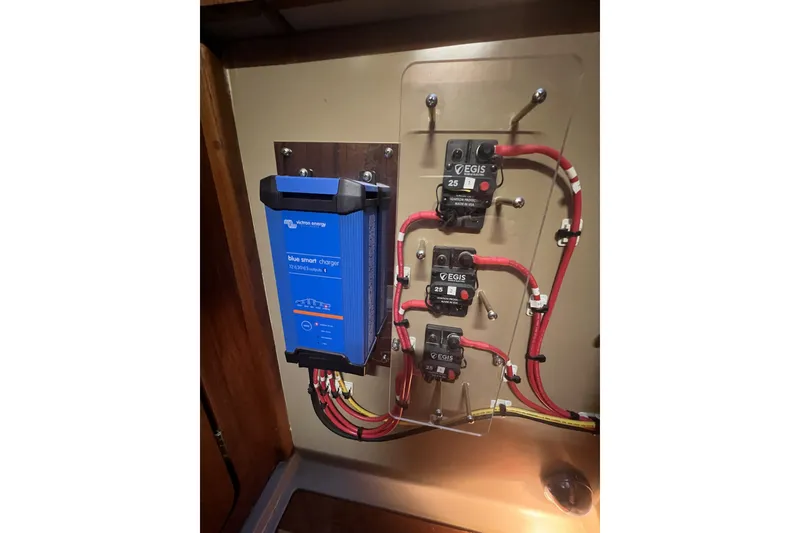 Slide: The Image of Electrical panel with Victron Energy charger and EGIS circuit breakers on a 1989 C&C 30 MKII sailboat. - 88