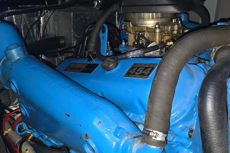 Slide: The Image of Engine of 1989 Silverton 34 Convertible boat, featuring a blue Crusader 454 model. - 33