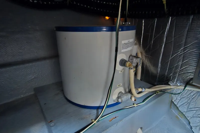 Slide: The Image of Water heater in 1989 Silverton 34 Convertible boat engine room. - 32