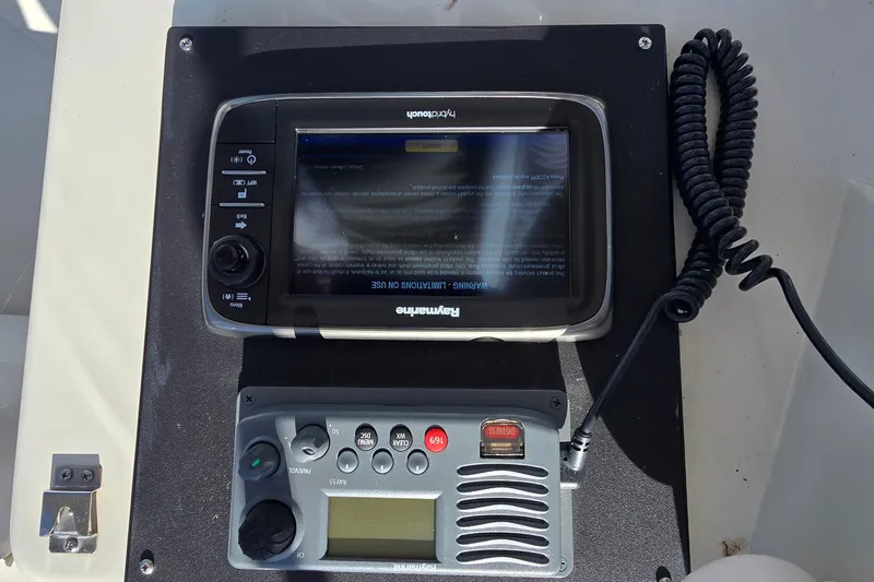 Slide: The Image of Control panel on a 1989 Silverton 34 Convertible boat with navigation equipment. - 13