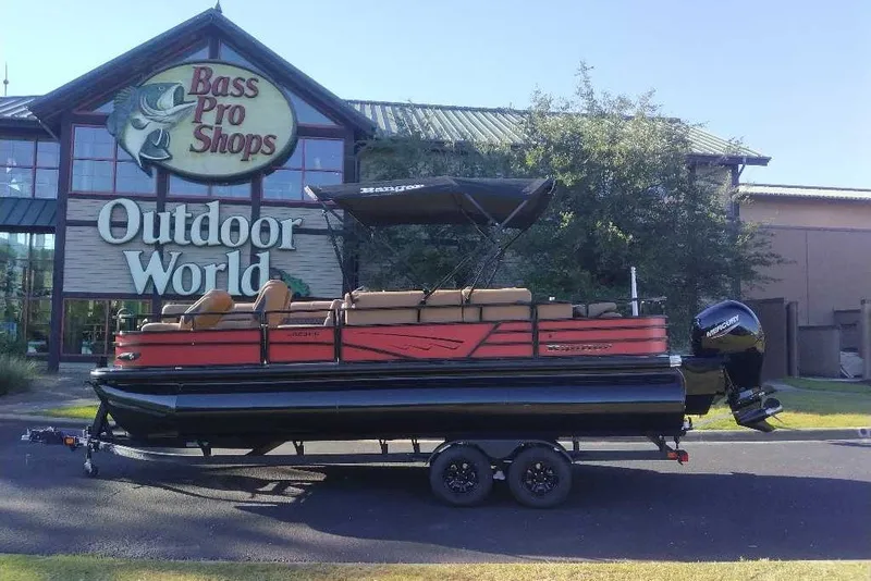 Slide: The Image of 2027 Ranger 223FC boat on trailer outside Bass Pro Shops Outdoor World. - 13