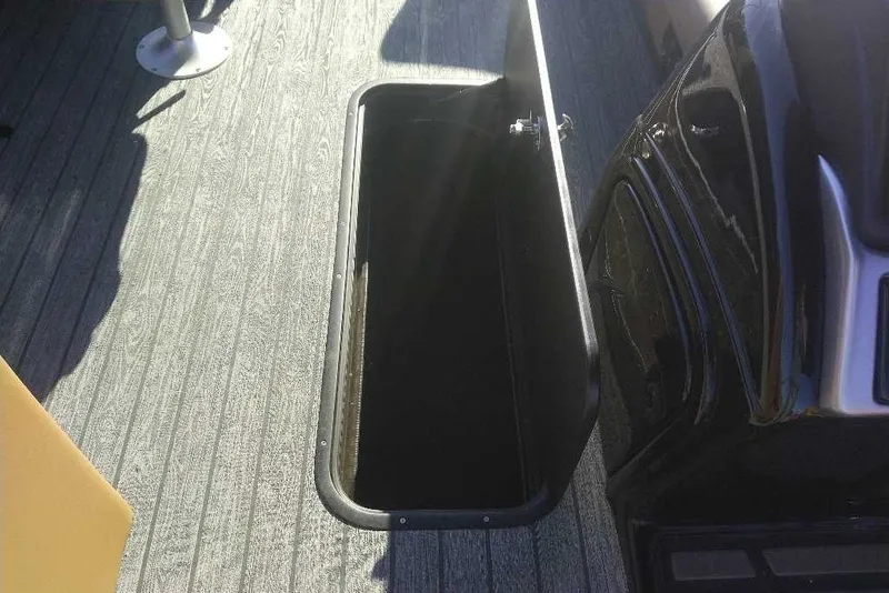 Slide: The Image of Open storage compartment on 2027 Ranger 223FC boat deck. - 9