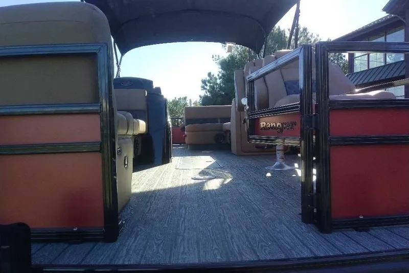 Slide: The Image of Interior view of 2027 Ranger 223FC pontoon boat with seating and canopy. - 3