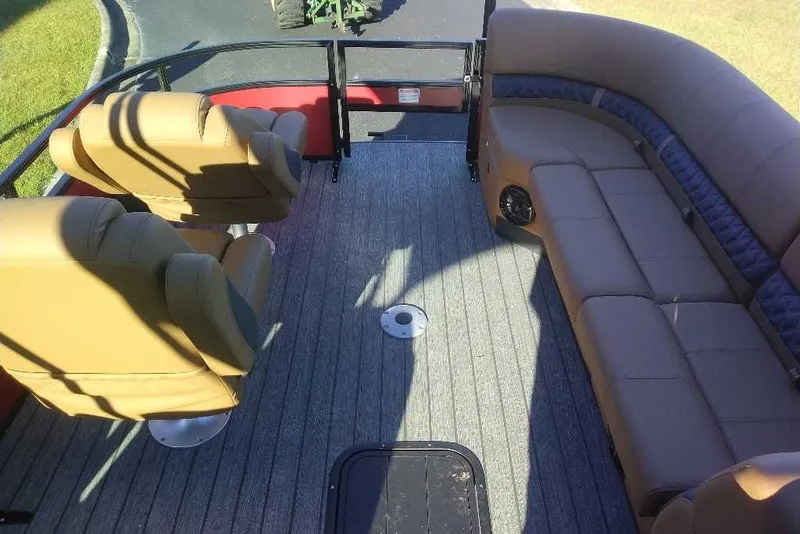 Slide: The Image of Interior of 2027 Ranger 223FC boat with tan seating and carpeted floor. - 2