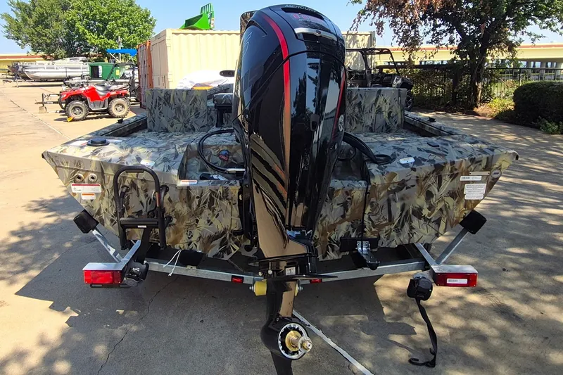 Slide: The Image of 2027 Ranger RB190 boat with camouflage design and powerful outboard motor on trailer. - 6