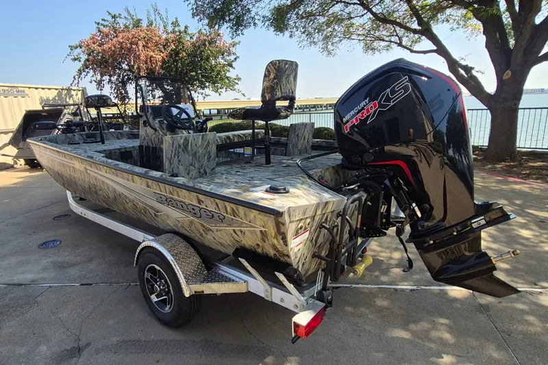 Slide: The Image of 2027 Ranger RB190 boat with camo design and Mercury Pro XS engine on trailer. - 7