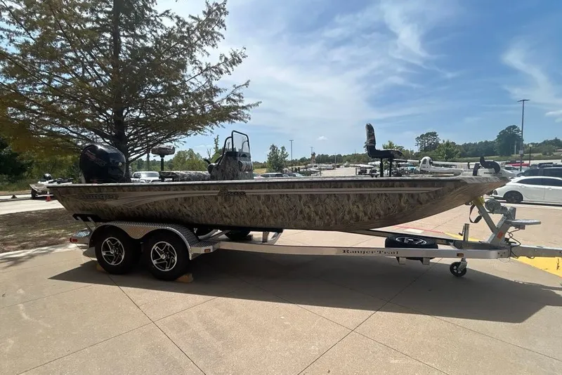 Slide: The Image of 2027 Ranger RB200 boat on trailer, parked outdoors under clear sky. - 10