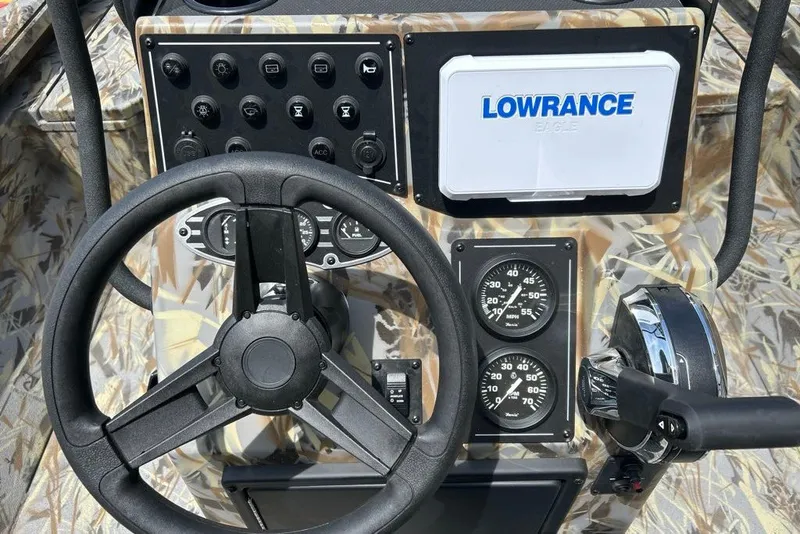 Slide: The Image of Steering console of 2027 Ranger RB200 boat with Lowrance electronics and control gauges. - 7