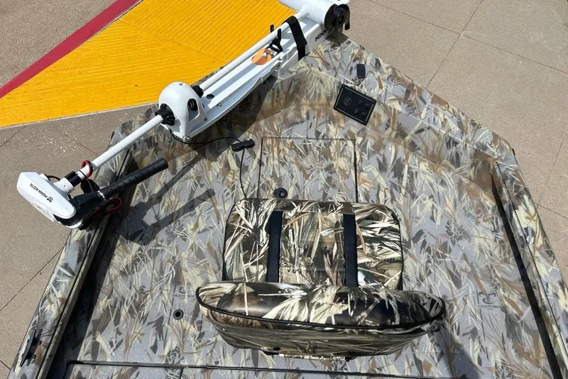Slide: The Image of 2027 Ranger RB200 boat with camouflage design and Minn Kota trolling motor. - 3