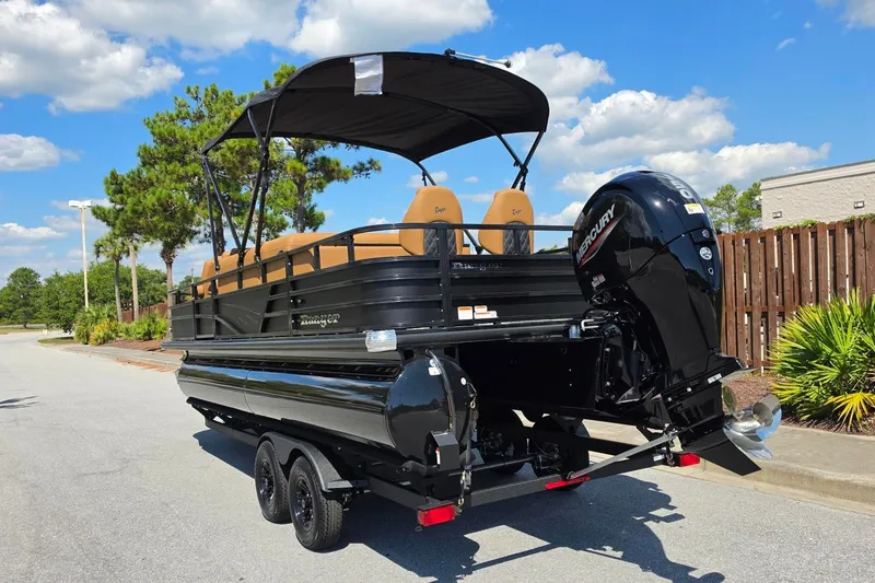 Slide: The Image of 2027 Ranger 220FC pontoon boat with Mercury outboard motor on a sunny day. - 14
