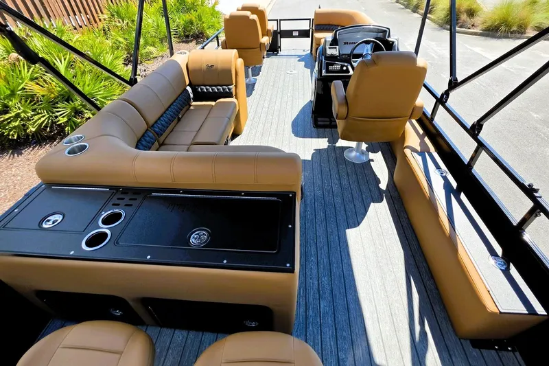 Slide: The Image of Luxurious interior of 2027 Ranger 220FC boat with tan seating and modern amenities. - 20