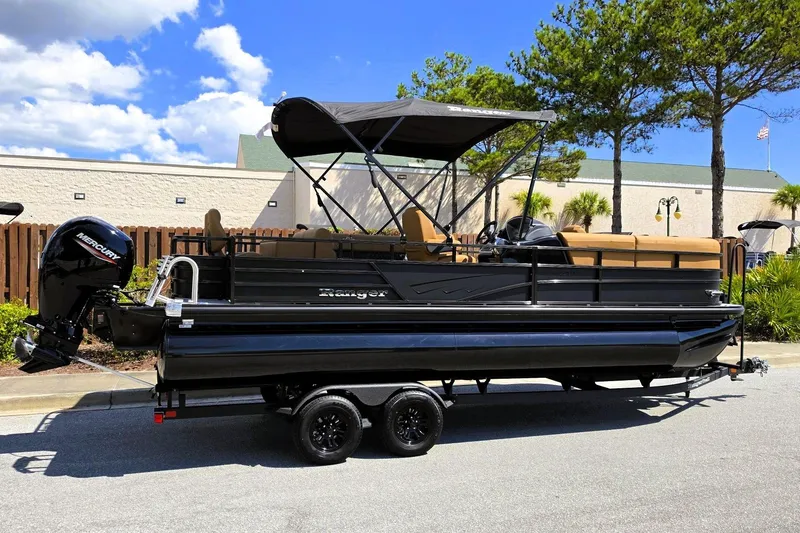 Slide: The Image of 2027 Ranger 220FC pontoon boat with canopy and Mercury outboard motor on trailer. - 2