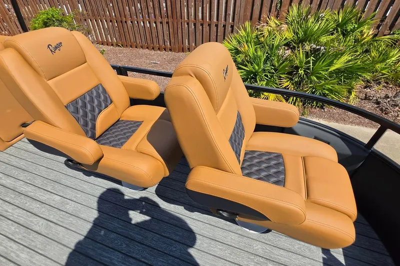 Slide: The Image of Luxurious tan seats on 2027 Ranger 220FC boat, featuring diamond-patterned accents. - 22