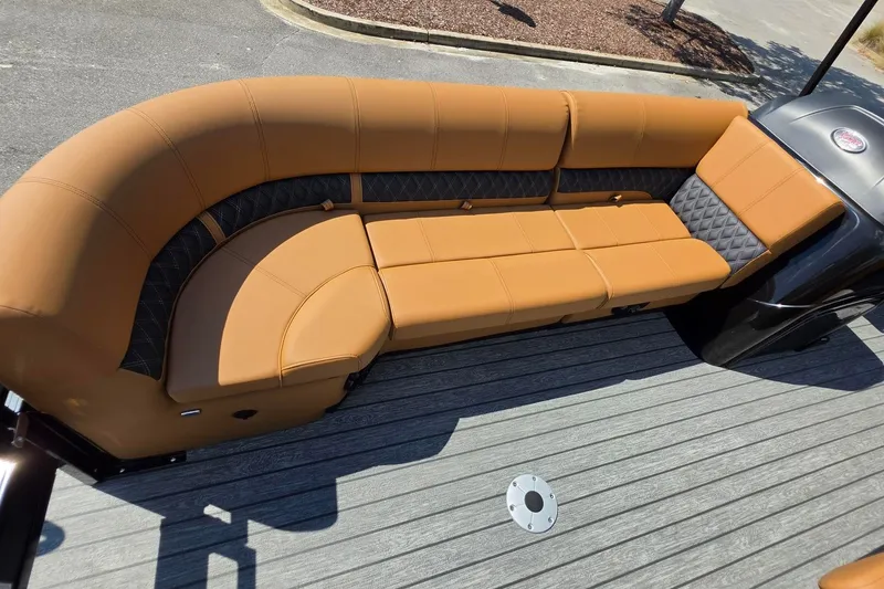 Slide: The Image of Luxurious tan seating on 2027 Ranger 220FC boat, featuring diamond-patterned accents and sleek design. - 23