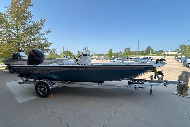 Slide: The Image of 2027 Ranger RB190 boat on trailer in outdoor setting, clear sky background. - 7