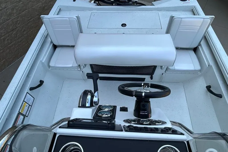 Slide: The Image of Interior view of 2027 Ranger RB190 boat cockpit with steering wheel and controls. - 15