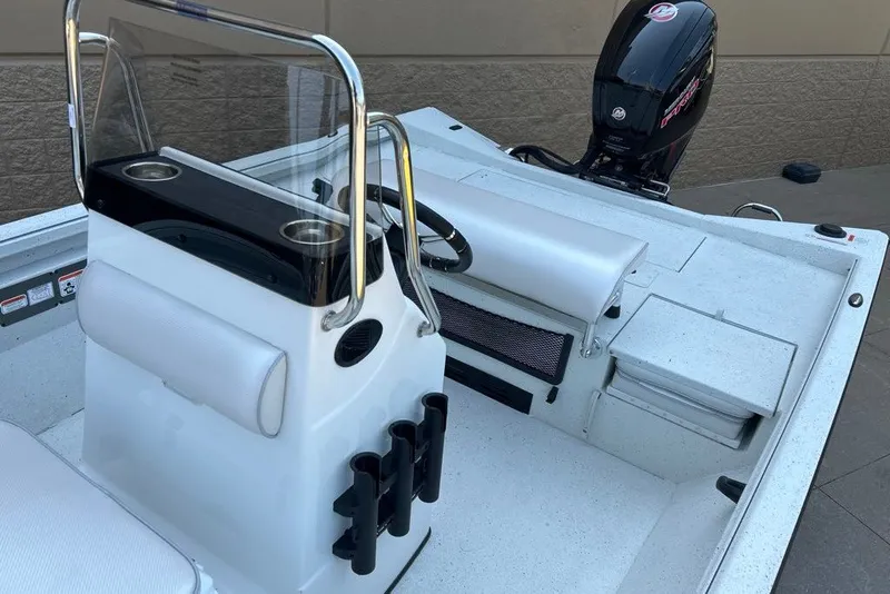 Slide: The Image of 2027 Ranger RB190 boat interior with steering console and outboard motor. - 13