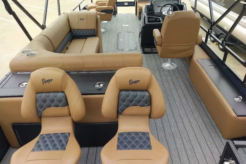 Slide: The Image of Luxurious interior of 2027 Ranger 223FC boat with tan and black seating. - 5