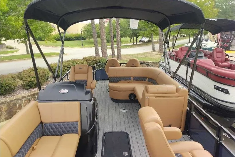 Slide: The Image of Luxurious 2027 Ranger 223FC pontoon boat with spacious seating and elegant design. - 8
