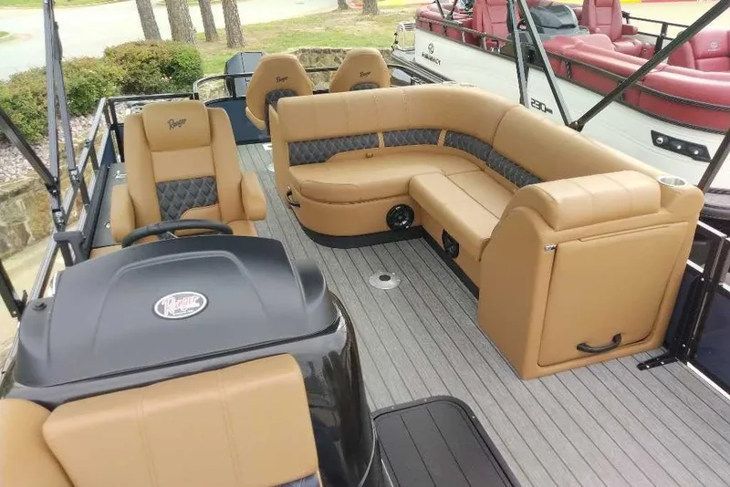 Slide: The Image of 2027 Ranger 223FC boat interior with tan seating and modern design. - 6
