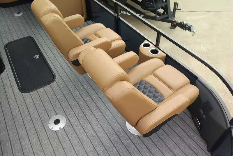 Slide: The Image of Luxurious seating on 2027 Ranger 223FC boat with cup holders and sleek flooring. - 9
