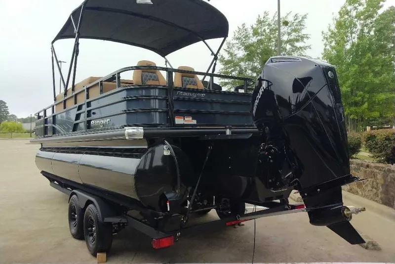 Slide: The Image of 2027 Ranger 223FC pontoon boat with canopy and powerful outboard motor. - 10