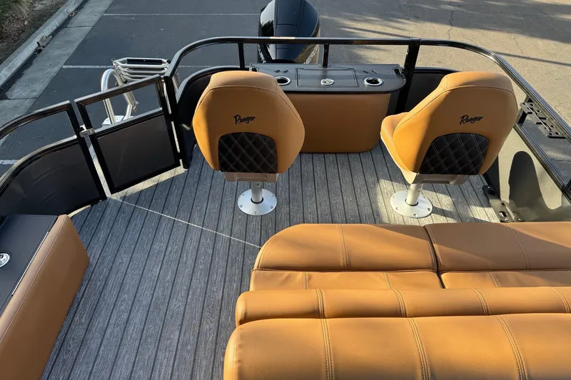 Slide: The Image of 2027 Ranger 223F boat interior with tan seating and sleek design. - 10