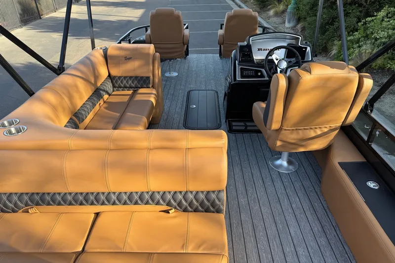 Slide: The Image of Luxurious interior of 2027 Ranger 223F boat with tan leather seating and modern dashboard. - 11