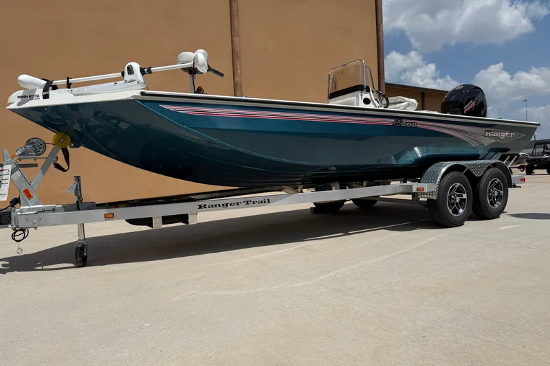 Slide: The Image of 2027 Ranger RB200 boat on trailer, parked outdoors under a clear sky. - 3