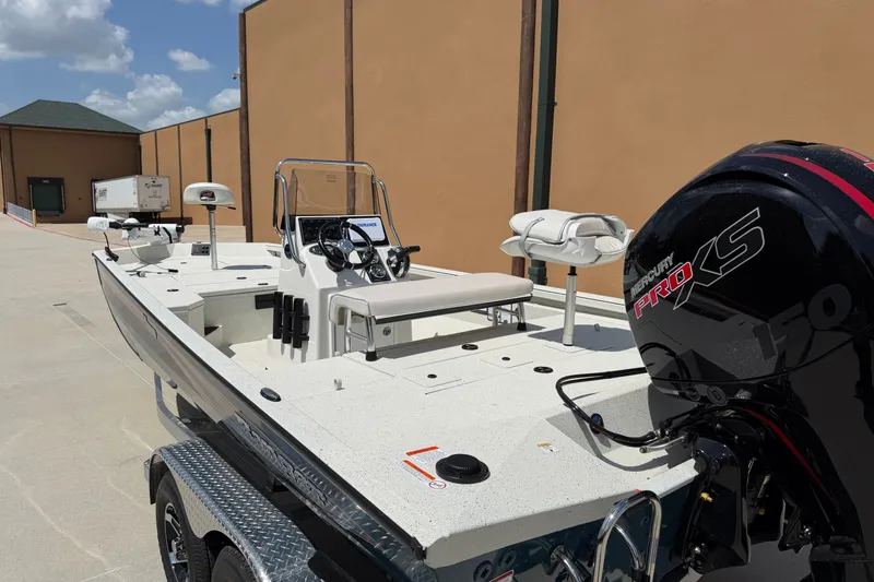 Slide: The Image of 2027 Ranger RB200 boat with Mercury Pro XS engine, parked outdoors on a sunny day. - 6