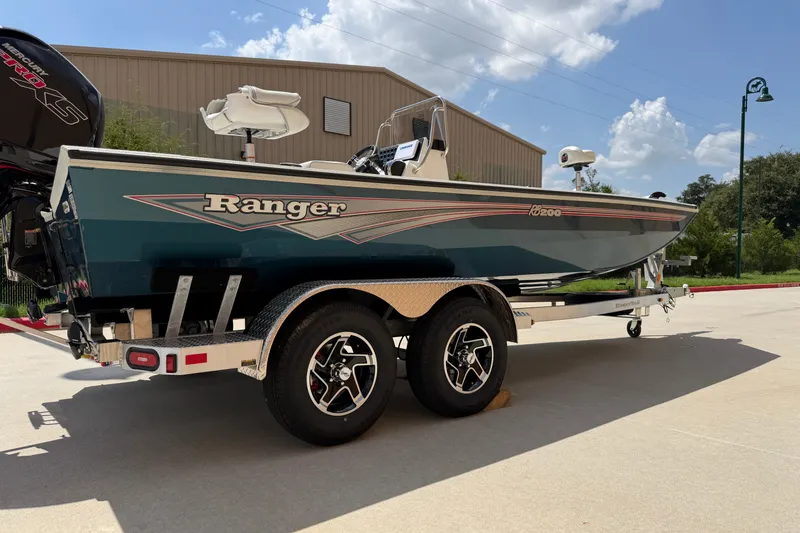Slide: The Image of 2027 Ranger RB200 boat on trailer, parked outdoors under a clear sky. - 5