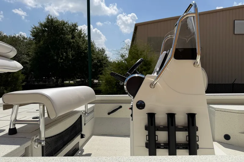 Slide: The Image of 2027 Ranger RB200 boat interior with steering console and seating under a sunny sky. - 8