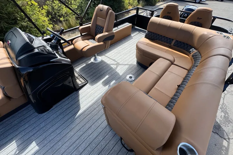 Slide: The Image of Luxurious interior of 2027 Ranger 220FC boat with tan seating and modern helm. - 14