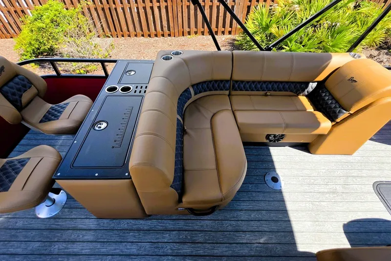 Slide: The Image of Luxurious seating on 2027 Ranger 223FC boat with tan upholstery and black accents. - 20