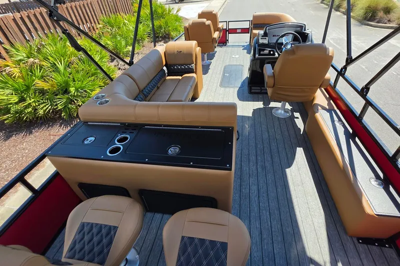 Slide: The Image of Interior of 2027 Ranger 223FC boat with tan seating and modern helm. - 19