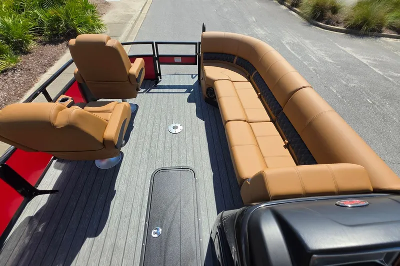 Slide: The Image of 2027 Ranger 223FC boat interior with tan seating and sleek design. - 21