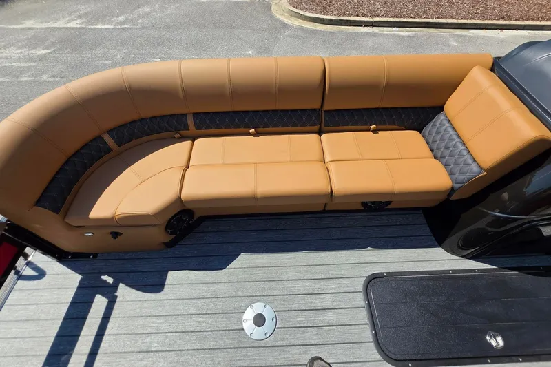 Slide: The Image of Luxurious tan seating on 2027 Ranger 223FC boat, featuring diamond-patterned accents and sleek design. - 23
