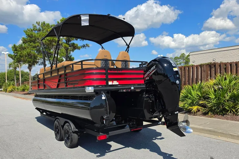 Slide: The Image of 2027 Ranger 223FC pontoon boat with Mercury engine on trailer, parked outdoors. - 14