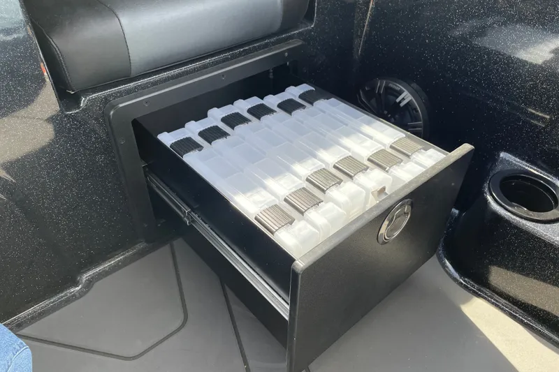 Slide: The Image of Storage compartment in 2027 Nitro ZV19 Sport boat, featuring organized tackle boxes. - 30