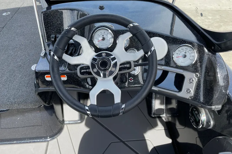 Slide: The Image of Steering wheel and dashboard of 2027 Nitro ZV19 Sport boat, featuring modern gauges and controls. - 15