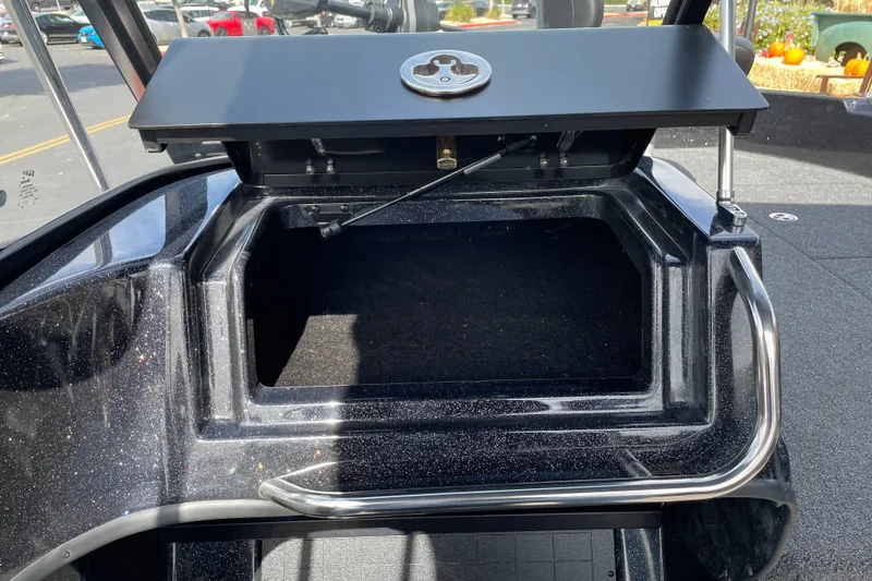 Slide: The Image of Open storage compartment on a 2027 Nitro ZV19 Sport boat. - 18