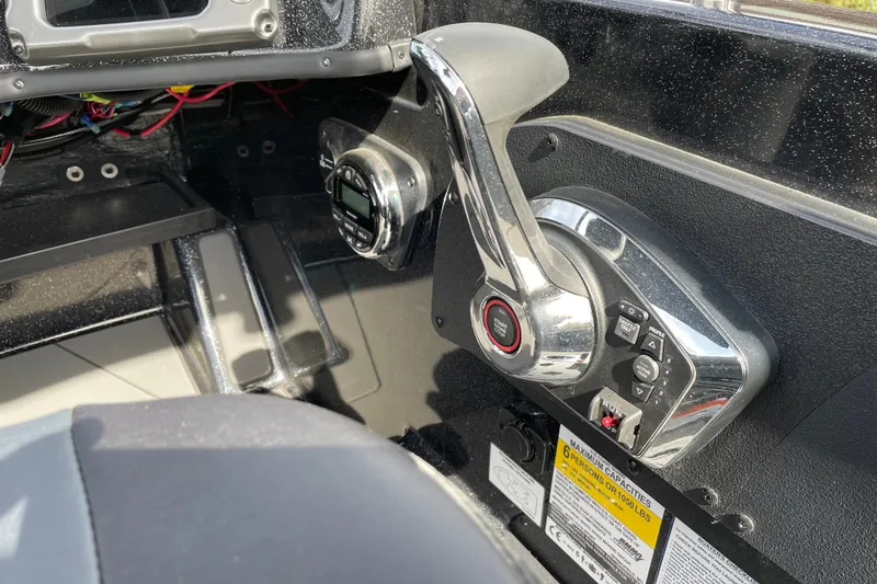 Slide: The Image of Control panel of a 2027 Nitro ZV19 Sport boat, featuring throttle and display. - 16