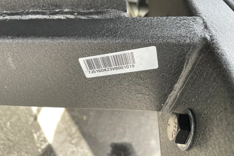 Slide: The Image of Barcode on Nitro ZV19 Sport 2027 vehicle frame with visible bolt. - 38
