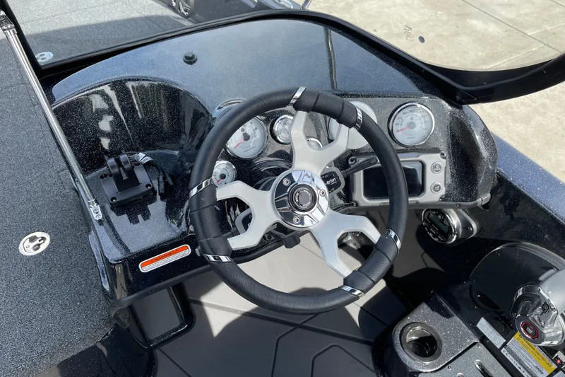Slide: The Image of Steering console of a 2027 Nitro ZV19 Sport boat with modern gauges and controls. - 14