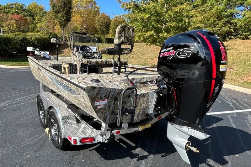 Slide: The Image of 2027 Ranger RB200 boat with Mercury Pro XS engine on a trailer in a scenic outdoor setting. - 6